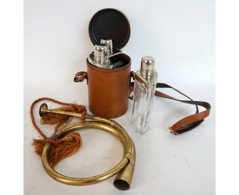 SET OF THREE SHAPED GLASS FLASKS
with silver plated mounts contained in a leather zipped case with a shoulder strap, together