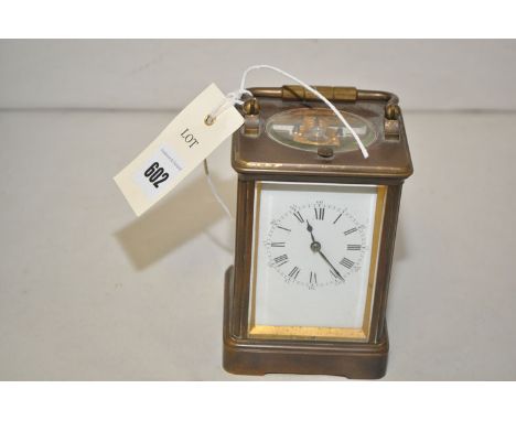 A brass cased carriage clock, stamped 24218, with glass panels, platform leaver escapement and repeat movement.