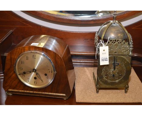 An Art Deco walnut veneered mantel clock; together with a reproduction brass lantern clock.  (2)