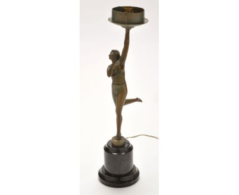 A green patinated metal Art Deco style table lamp, in the form of a nude female figure, patinated metal on black marble base,