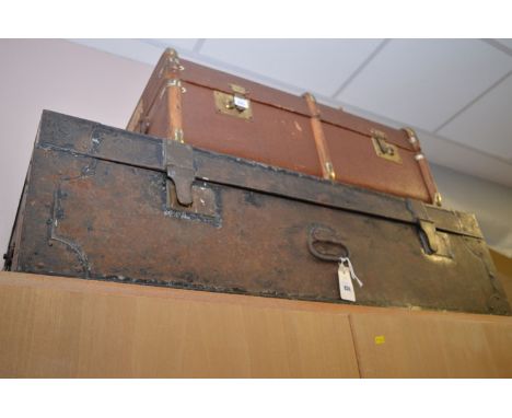 An early 20th Century black painted metal travelling trunk, initialled 'E.H.H.' to top, 107cms wide; together with an early 2