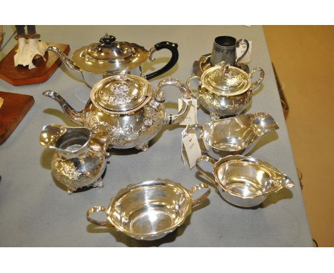 A three-piece EPNS tea service by John Turton & Co.; together with a three-piece tea service; a sauce boat; a christening cup