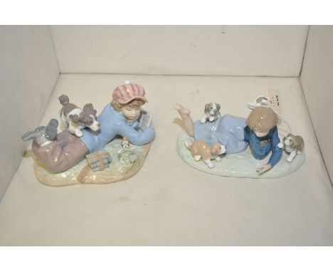 Two Lladro groups of children playing with puppies.