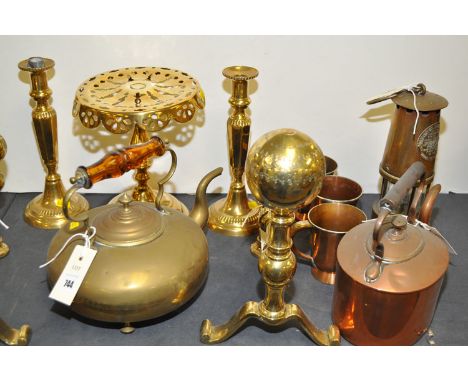 A brass protector lamp and lighting miners lamp by Eccles Manchester, Type A1; a pair of andirons; trivet; pair of candle sti