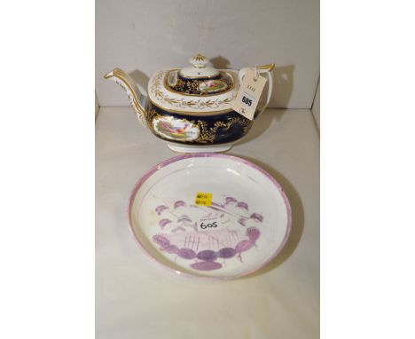 A 19th Century teapot, decorated with fabulous birds on a blue and gilt surround; together with a pink lustre plate (damaged)