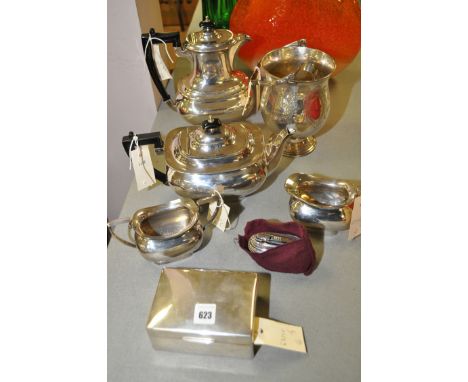 A silver mounted cigarette case; a four-piece plated tea service, by Walker & Hall; a plated ice pail with tongs; and a Ronso