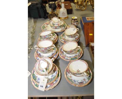 A Minton part breakfast service, comprising: breakfast cups, saucers, tea plates and others, no. 13154; a Royal Crown Derby '