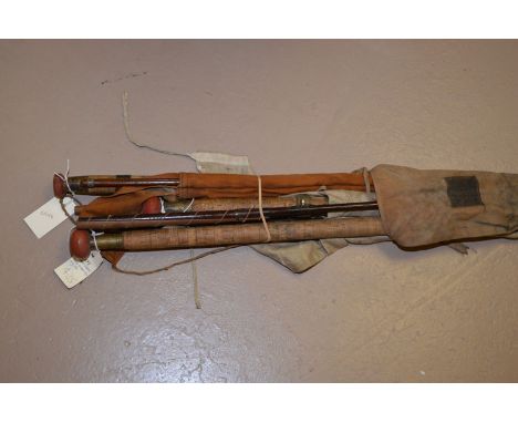 Three vintage Greenheart fishing rods, comprising: two-piece by Herbert Hatton with spliced joints; three-piece Greenheart ro