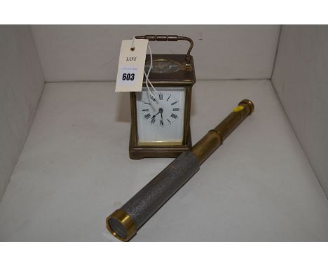 A brass cased carriage clock with glass panels; and a two drawer telescope.