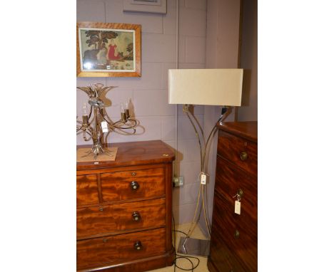 A modern chrome standard lamp with cream silk shade; and modern chrome steel six branch electric chandelier.  (2)