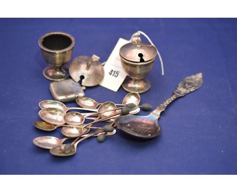 A late Victorian silver vesta case, Birmingham 1900; a pair of silver mustard pots, Birmingham 1865; two sets of silver coffe