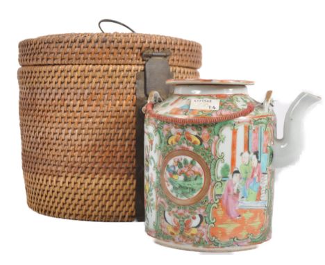 A 19th Century Chinese Cantonese export porcelain famille rose medallion teapot held within the original woven cane basket. M