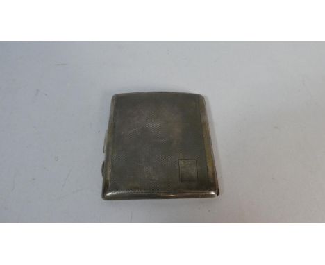 A Silver Cigarette Case with Engine Turned Decoration 
