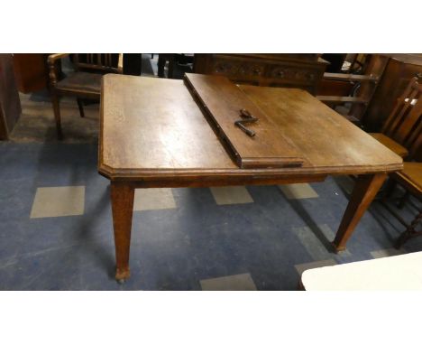 An Edwardian Oak Wind Out Dining Table on Square Tapering Legs with One Extra Leaf 