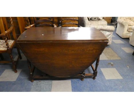 An Oak Gate Leg Drop Leaf Dining Table, 122cm wide 