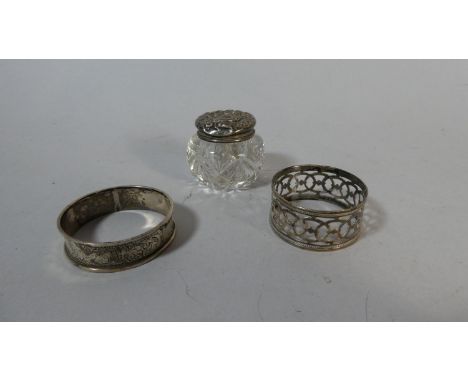 A Silver Topped Glass Miniature Dressing Table Pot and Two Napkin Rings 