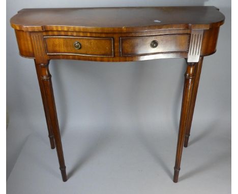 A Serpentine Front Side Table with Turned Reeded Supports and Two Drawers, 82cm Wide 