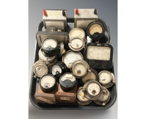 A collection of gauges measuring amps, volts, etc.
