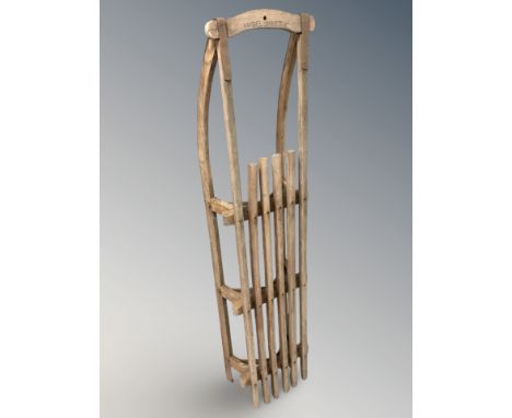 An early 20th century oak sledge, length 144 cm 
