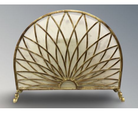 A decorative metal fire screen, width 99 cm.