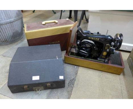 A vintage Singer sewing machine and a typewriter (locked without key) 