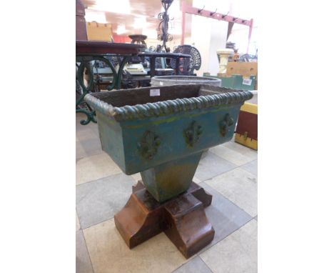 A Victorian cast iron drain hopper (converted to a planter) 