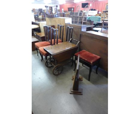 An oak drop leaf trolley, a piano stool, firescreen and four chairs 