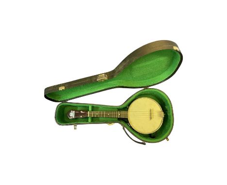 A George Formby model banjolele (ukulele banjo) in green lined hardcase.