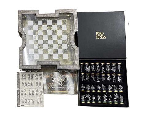 A Collector's Edition Lord of the Rings chess set by Noble, with highly detailed raised board and a full set of boxed die-cas