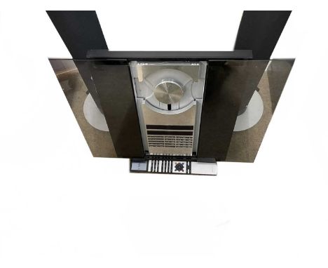 A Bang and Olufsen (B&amp;O) Beocenter 2300 CD/Radio player, together with a pair of B&amp;O Beolab 6000 tall floor speakers.