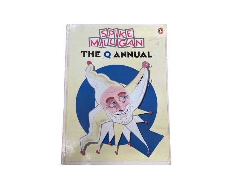 A copy of The Q Annual 1985, bearing the signature of Spike Milligan in black ink to first page