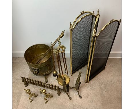 Brass fire set. Coal bucket, companion set with horse head handles, spark guard, two sets of brass fire dogs, brass grate fro