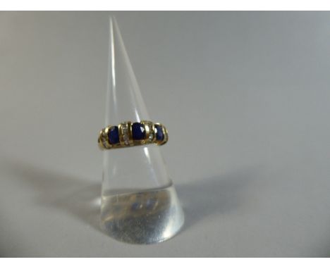 A 9ct Sapphire and White Stone Dress Ring. Size N. Total Weight 3.2gms