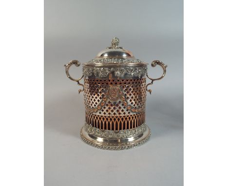 A Sheffield Plate Pierced Cylindrical Two Handled Biscuit Barrel with Cobalt Blue Liner. Hinged Lid with Fruit Finial. 20cms 