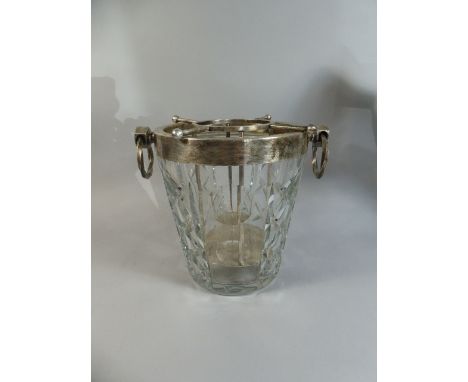 A Heavy Cut Glass Champagne Bucket with Silver Plated Removable Bottle Carrier and Silver Plated Rim with Two Ring Handles of