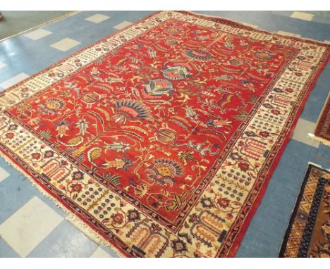 A Patterned Persian Tabriz Carpet Square on Red Ground. 336 x 262 cms