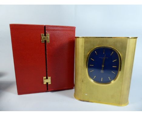 A Cased Patek Philippe Solar Powered Gilt Brass Cased Mantel Clock of Oval Form.  No 1.802.024