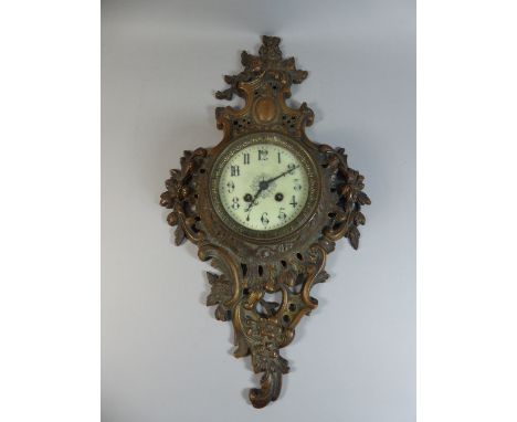 A Continental Brass Wall Clock with Naturalistic Pierced and Moulded Surround, White Enamel Dial and Arabic Numerals.   57cm 