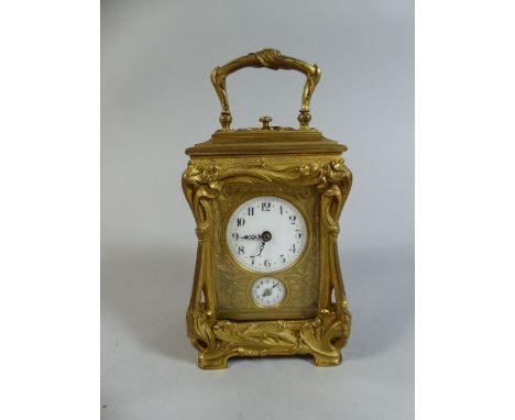 A Small 19th Century Brass French Carriage Clock with Repeater Movement Chiming on a Gong.  White Enamel Dial with Arabic Num