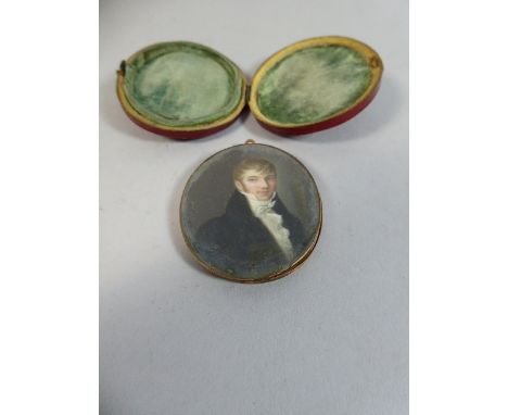 A Cased Mourning Oval Portrait Miniature on Ivory with Lock of Hair Fashioned into a Corn Sheaf Verso.  In Gold Frame.  Requi