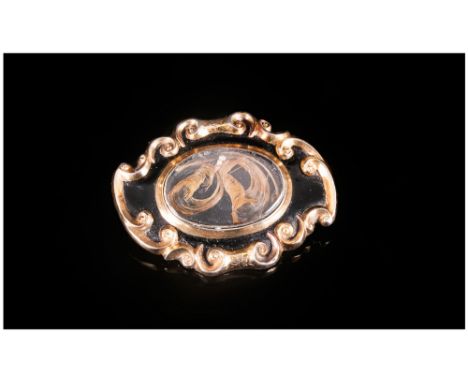 Black Enamel and Gilt Mourning Brooch, containing a design in light coloured hair with seed pearls to the oval glass front, b