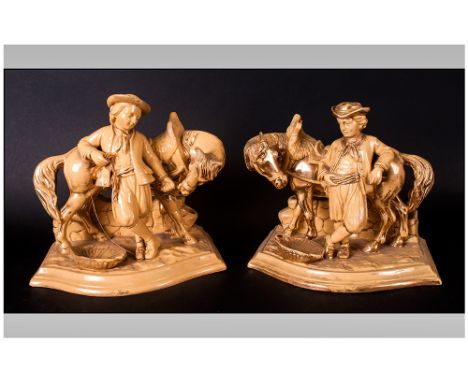 Pair of Eichwald Pottery Figures of a Man Reclining on a Horse with Pipe Rack To The Back, High lighted In Gilt work. Right a