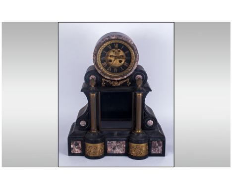 Large Black Slate French 19th Century Mantle Clock with an exposed glass front with Brass column sides with Pineapple finials