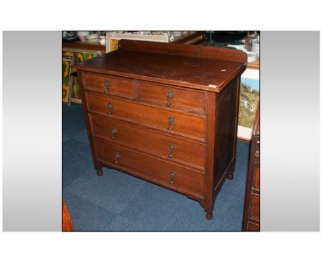 Early 20thC Light Oak Chest of Drawers, two short over three long graduating drawers. Raised on turned feet, brass handles. H