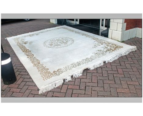 Large Chinese Ivory Coloured Carpet with a picked out embossed floral border in beige colour. 110x140''