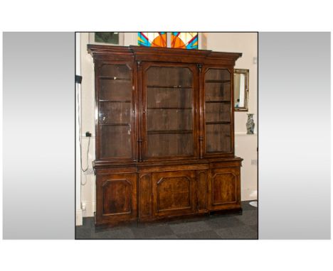 A William IV Fine Pollard Oak Breakfront Library Bookcase Circa 1835. The upper section with a moulded cornice, above 3 large