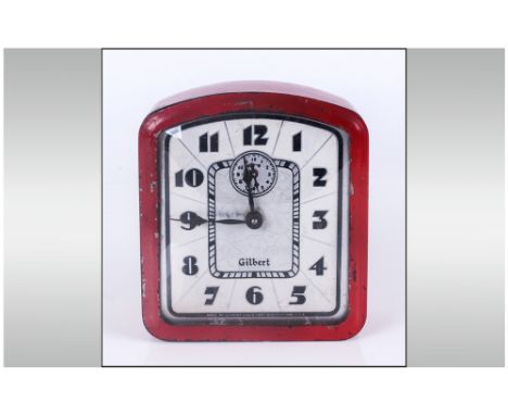 Gilbert Art Deco Alarm Clock, iron red painted tin case, cream face with stylised black numerals, centred by a black and silv