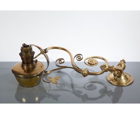 VICTORIAN BRASS WALL MOUNTED OIL LAMP
with scrolling ivy arm, missing globe, 59cm long, 60cm high