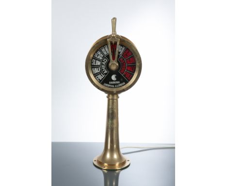 MINIATURE BRASS SHIP'S TELEGRAPH
with black glass indicator dials, fitted with electric light, 50cm high
