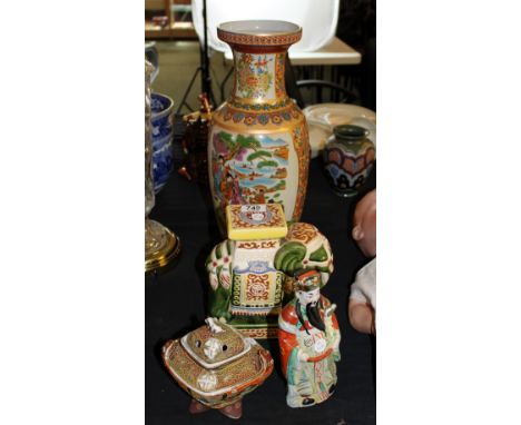 Four Oriental ceramic figures including vase